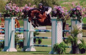 Zoie Nagelhout and Vitoria Champion Modified Junior Amateur Jumper 2011 Blenheim Red White and Blue Classic Photo Flying Horse