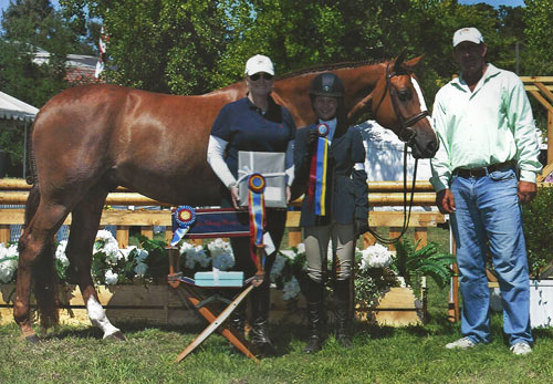 Hunter Siebel and Pure Abundance with Caerrie Robinson and Archie Cox Champion Large Junior Hunter 15 & Under 2013 Menlo Charity Photo JumpShot