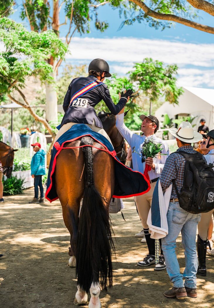 Dane Anson and Celestino, with Archie Cox and Karli Postel Champion Gladstone Eq Challenge - West 2025 Adequan/USEF Junior Hunter National Championship - West Del Mar, California Photo by Captured Moment