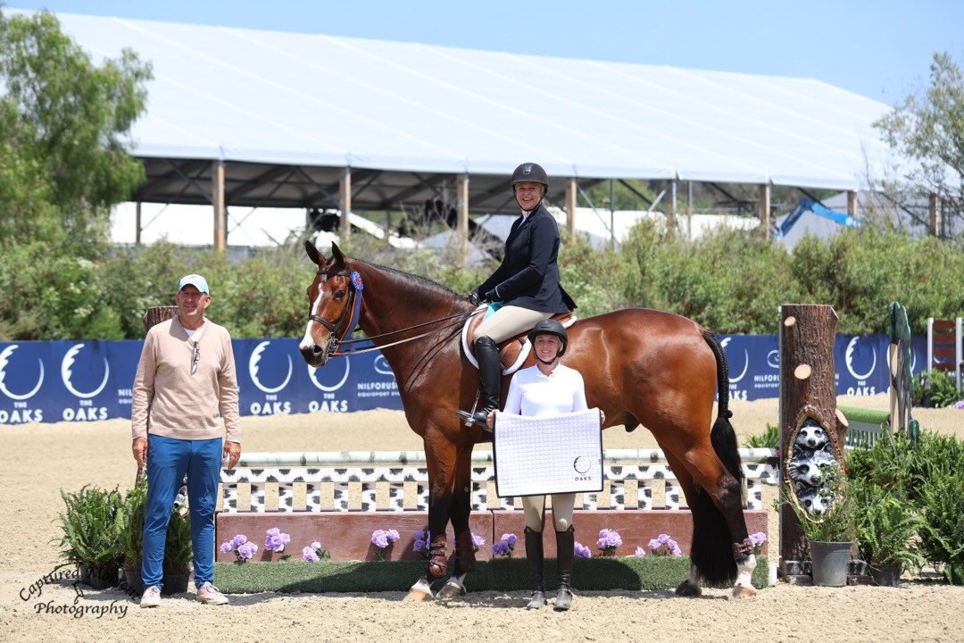 Jaime Krupnick and Troubadour, with Archie Cox and Karli Postel Adult Equitation Champion 2026 Oaks Capistrano Cup 1 Photo by Captured Moment